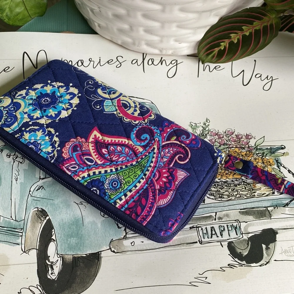 Paisley print wristlet ITEMS $8 or less BOGO . Bundle I will discount.